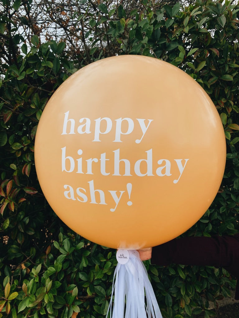 and it was fun personalised balloon with custom text - yellow balloon says happy birthday ashy!